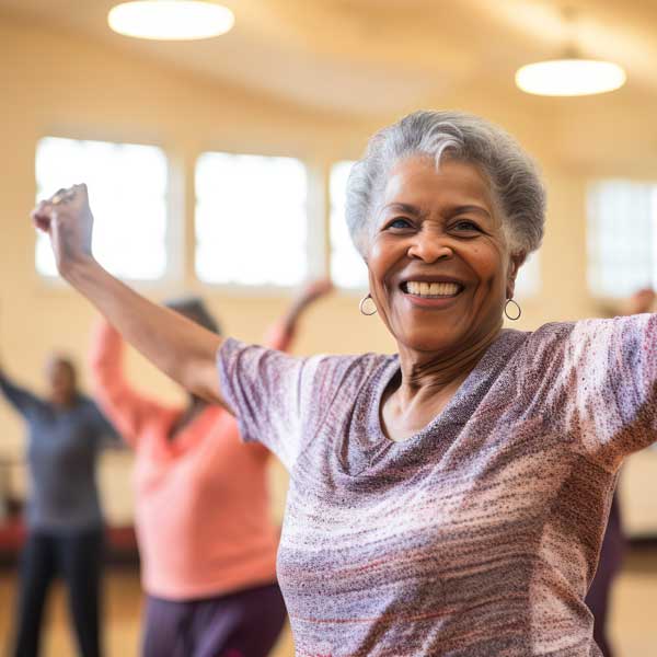 An older woman practicing yoga in a gym. An Older Woman Practicing Yoga In A Gym.